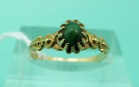 An 18ct gold ring (French hallmarks) set with a turquoise cabochon (Size K)
