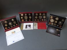 Four Royal Mint UK proof coin collections comprising 1998, 2002,