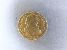 A 1782 gold Spanish Escudo bust of Charles III 3.