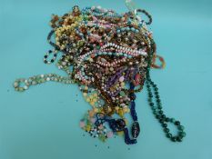 A collection of beaded necklaces to include glass millefiori beads, malachite,