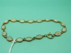 A 9ct gold bracelet set with opals, 3.