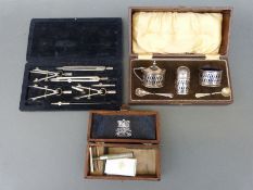A cased plated cruet set,