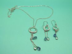 A 9ct white gold necklace with two drop briolette cut sapphires, with matching earrings.