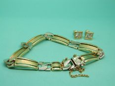 A gold bracelet marked 585 (22.2g) together with a pair of gold earrings set with cubic zirconia.