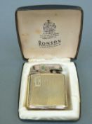A 9ct gold mounted Ronson lighter in case