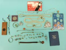 A collection of jewellery to include paste brooch, faux pearls, earrings,