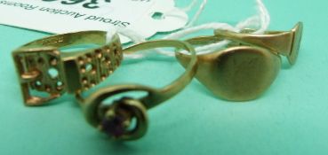 Two 9ct gold signet rings, a 9ct gold buckle ring and a 9ct gold ring set with a ruby, weight 6.