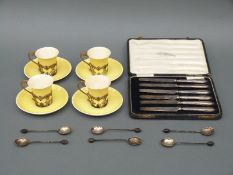 Four Aynsley cups and saucers with hallmarked silver mounts,