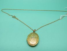 A 9ct gold chain and a yellow metal locket marked 9k back and front
