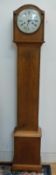 A c1930 light oak cased granddaughter long cased clock with beaded carved decoration,