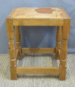 A Robert 'Mouseman' Thompson oak and leather stool with signature carved mouse to one leg (H46 x