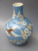 A CH Brannam pottery vase decorated with birds and flowers,