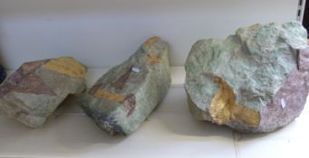 Three large hardstone boulders,
