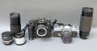 Nikon FA SLR camera with winder and fitted with 2x macro teleconverter,