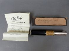 A boxed Otis King spiral slide rule calculator,