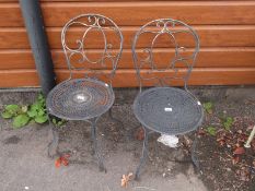 A pair of garden chairs