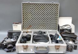 A quantity of SLR cameras and accessories to include Praktica, Minolta XG9, Zenit ET,
