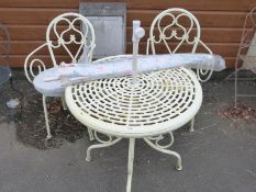 A garden table and two chairs