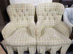 A pair of button back armchairs
