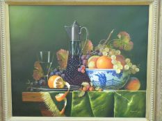Raymond Campbell 20thC oil on canvas still life of fruit in an Oriental bowl with claret jug,