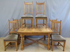An oak Arts and Crafts light oak table retailed by Robson and Sons Ltd,