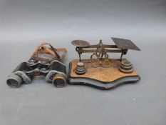 A small set of brass balance scales and weights together with a pair of Dienstglas prismatic