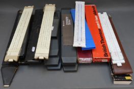Approximately twenty slide rules including British Thornton, Faber Castell, Blundell,