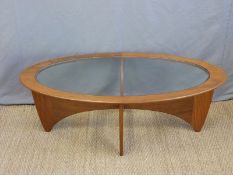 A retro G-Plan glazed coffee table raised on shaped legs (H42 x L115 x W62cm)