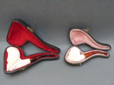 Two Meerschaum style pipes in cases