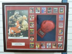 A Frank Bruno signed boxing glove in frame,