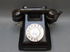 A vintage bakelite telephone marked 332L GPO,