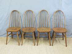 A set of four Ercol hoop and stick back dining chairs