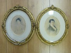 A pair of Victorian watercolour portraits comprising lady with pearl necklace and gentleman in a