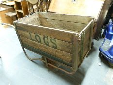 A wooden two wheeled garden trolley