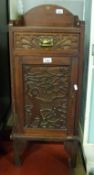 A 19thC mahogany pot cupboard with fretwork deep sea diver design,