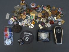 A collection of various badges etc including military, enamelled, Russian, Coronation medal 1937,