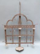 A 19thC blacksmith made tea holder,