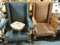 A pair of late 19th/20th century oak framed wingback chairs