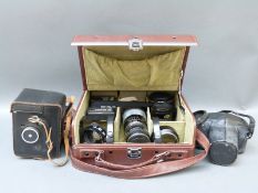 Pentax MG SLR camera with Pentax 1:2 50mm lens together with Tokina 135mm 1:2.