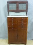 A mahogany dentist's cabinet with glass top having fourteen variously sized drawers with glass