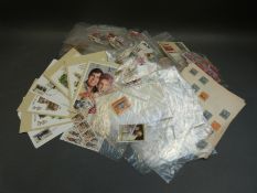 A box of various loose stamps