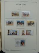 Four albums of Channel Island and Isle of Man stamps