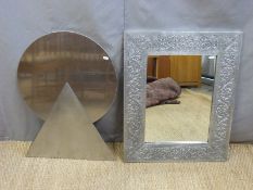 A stainless steel wall ornament and a decorative aluminium framed wall mirror
