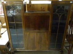 A walnut display cabinet,