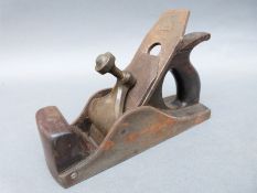 A Norris or similar vintage woodworking plane with brass clamp and rosewood handles,