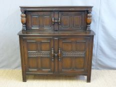 An Ercol court cupboard (H123 x W124 x D45cm)
