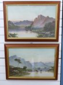 A pair of early 20thC watercolour highland loch landscapes with cattle watering,