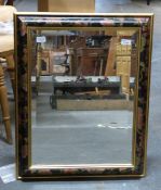 A decorative mirror with bevelled glass