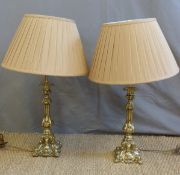 A pair of heavy brass ornate table lamps
