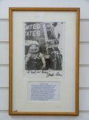 A framed photo of John Glenn,